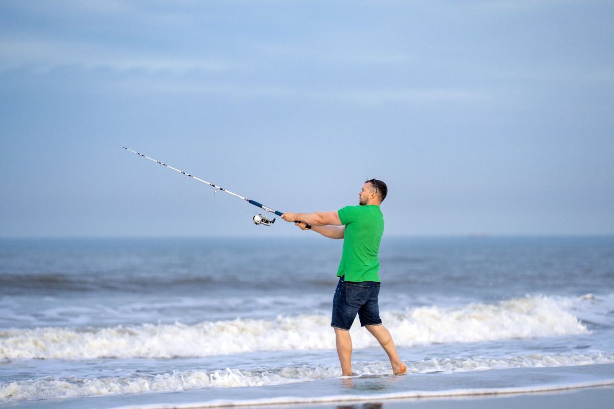 man fishing on beach
